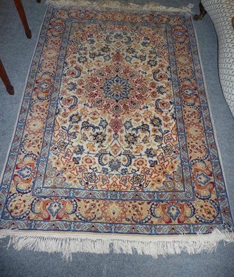 Lot 1357 - Isfahan Part Silk Rug Central Persia The cream field of scrolled leaves and vines centred by a...