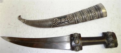 Lot 339 - A 19th Century Albanian Jambiya, the double edge curved steel blade with medial ridge, the wood...