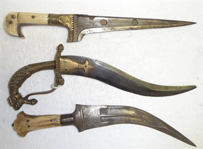 Lot 340 - A 19th Century Indian Peshkabz, the 20cm T section steel blade inset with brass star motifs,...