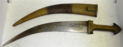 Lot 343 - A Caucasian Kindjal/Jambiya, the curved steel blade engraved with tendrils and leaves, the polished