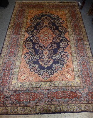 Lot 1365 - Kashmir Rug North West India The deep indigo field of flowering vines around a peach pole medallion