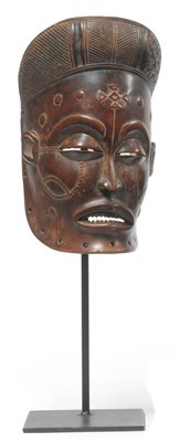 Lot 361 - A Chokwe, Angola Wood Mwano Pwo Mask, with diapered and ridged diadem type coiffure lacking...