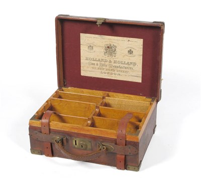 Lot 380 - A Holland & Holland Stitched Leather Cartridge Case, bound with brass, the eight oak lined...