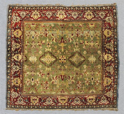 Lot 1371 - Agra Rug Central North India The shaded mint green field with a lattice of stylised flowers and...