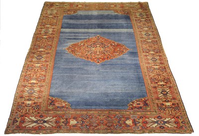 Lot 1375 - Feraghan Carpet West Persia The shaded indigo field with central madder floral medallion framed...