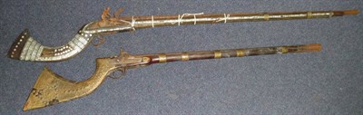 Lot 519 - A 19th Century Afghan Flintlock Jezail, the 108cm steel barrel with flared muzzle, steel lock plate