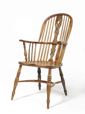 Lot 1406 - A 19th Century Nottinghamshire Medium Height Yew Windsor Armchair, circa 1860, the pierced...