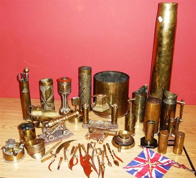 Lot 83 - A Collection of Trench Art, including embossed and chased shell cases, a model cannon, an RAF table