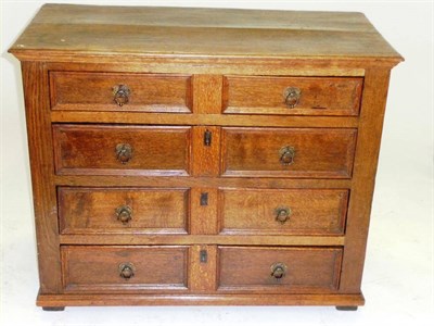 Lot 1412 - A 17th Century Oak Four Drawer Chest, the moulded top above four long drawers with recessed...