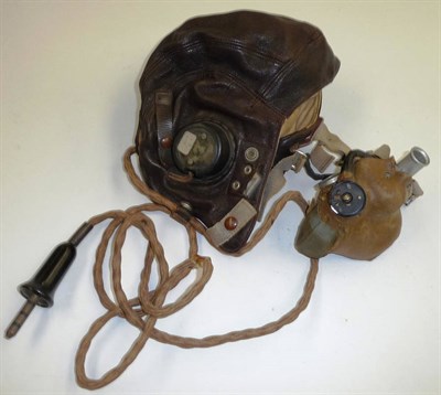 Lot 103 - A Second World War RAF Leather Flying Helmet, C Type, the bakelite earphones marked AM centred by a