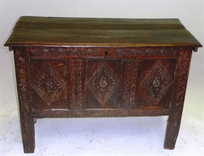 Lot 1414 - A Late 17th Century Joined Oak Chest, the boarded lid above a lunette carved frieze with...