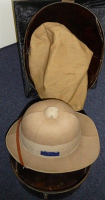 Lot 111 - A Second World War Pith Helmet, the three fold puggaree set with a blue patch, with leather...