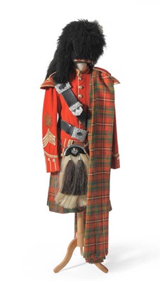 Lot 116 - A Scottish Pipe Major's Full Dress Uniform, comprising a red tunic with staybrite buttons, arm...