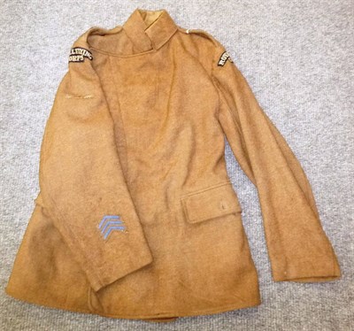 Lot 124 - A First World War Royal Flying Corps Maternity Tunic, with cloth shoulder flashes, leading...