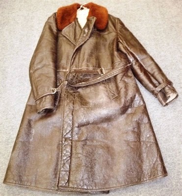 Lot 128 - A Post-Second World War Sheepskin Lined Brown Leather Trench Coat, with brown sheepskin lined rever