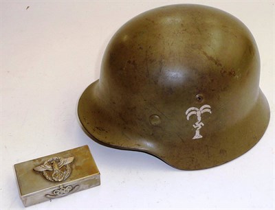 Lot 134 - A German M1935 Helmet, with rolled edge, the inner rim stamped 4478 and SES4, with leather...