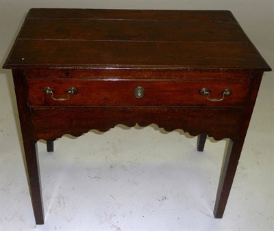 Lot 1418 - A George II Oak Side Table, mid 18th century, the three plank top above a single frieze drawer...