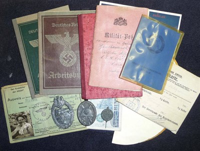 Lot 147 - A Small Collection of German Third Reich Items, including a Wound Badge in silver, a Tank...