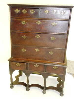 Lot 1420 - An Early 18th Century Oak Chest on Stand, the bold cornice above two short and three long...