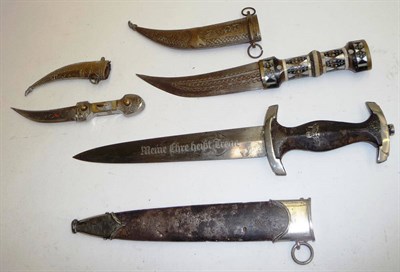 Lot 180 - A German Third Reich SS Dagger, the double edge steel blade etched `Meine Ehre heist treue',...