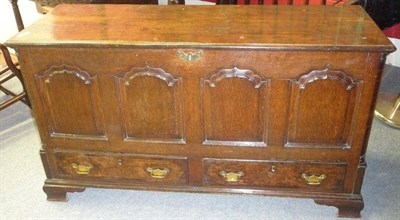 Lot 1422 - A Mid 18th Century Joined Oak Chest, the boarded lid over four fielded panels between moulded...