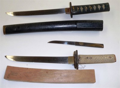 Lot 195 - A Japanese Tanto, with signed 22.5cm steel blade, one piece copper habaki, pierced iron tsuba,...