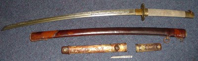Lot 203 - A Japanese Style Katana, the 64cm single edge cast steel blade with a silver tendril inlaid...