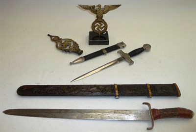 Lot 204 - A Chinese Sword, the broad double edge steel blade stamped with a star and chevron pattern,...