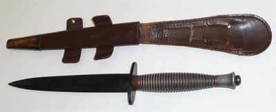 Lot 240 - A Third Pattern Commando Knife, with hand forged steel blade, ringed alloy grip, the pommel...