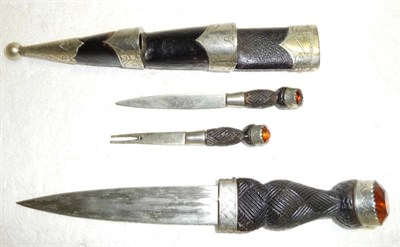 Lot 245 - A Scottish Small Dirk, with plain 12cm double edge steel blade, the wood basket weave carved...