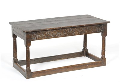 Lot 1428 - A 17th Century Joined Oak Dining Table, the three plank rectangular top above a moulded and...