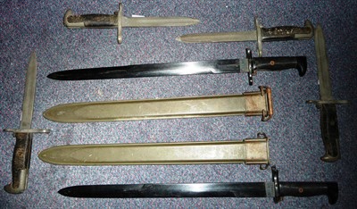 Lot 247 - Four Knife Bayonets in the US Model 1942 Springfield Style, lack scabbards; two US Practise...