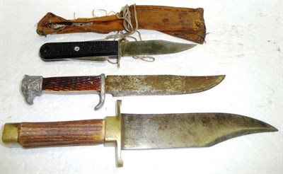 Lot 251 - A Bowie Knife, with hatchet tip steel blade, brass crossguard and pommel and antler grip; an...