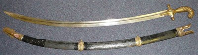 Lot 255 - An Indian Sword, the 84cm single edge curved fullered steel blade faintly etched with scrolling...