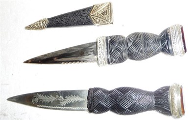 Lot 273 - A Scottish Skein Dhu, with scallop back steel blade, basket weave decorated ebonised grip with...