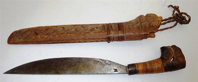 Lot 282 - A Malayan Golok, with 27cm straight back single curved edge steel blade, cane bound wood grip...