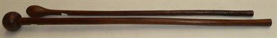 Lot 287 - A Zulu Knobkerrie, of hardwood, with small globular head and cylindrical haft, 88cm; a Similar...