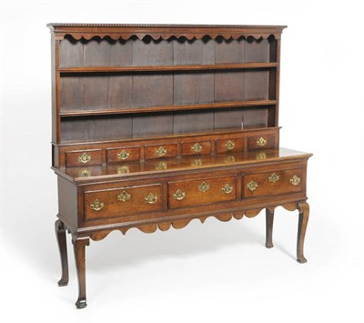 Lot 1433 - A George III Oak Dresser and Rack, possibly Shropshire, third quarter 18th century, the dentil...