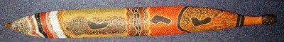 Lot 301 - An Australian Aborigine Woomera (Spear Thrower), of curved bent wood, brightly painted with...