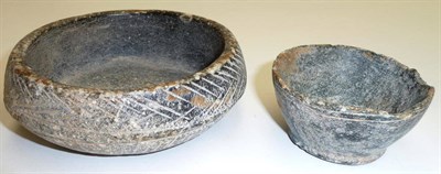 Lot 323 - An Omani Steatite Bowl, possibly 8th-7th Century B.C., of shallow circular form, the exterior...