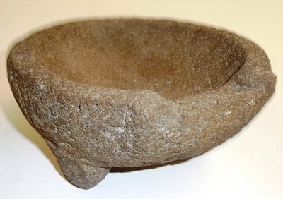Lot 330 - A Lava Stone Molcajete (Grinding Bowl), of shallow circular form, with indented lip, on three stilt