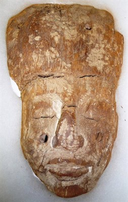 Lot 338 - An Egyptian Mummy's Wood Mask, with high domed headdress, closed eyes, flattened nose and close...