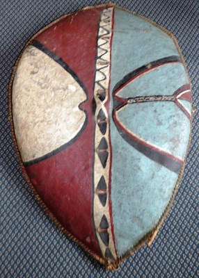 Lot 345 - A Masai, Kenya Large Hide Shield, of elliptical form, bound to the bent wood frame with strips...