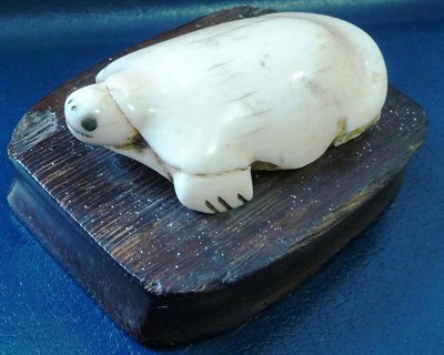 Lot 351 - A 19th Century Ivory Figure of a Turtle, possibly North American, with inset horn eyes, on a...