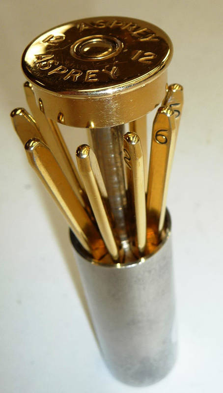 Lot 371 - An Asprey's `Cartridge' Place Finder, in the form of a 12 bore shotgun cartridge in gilt and...