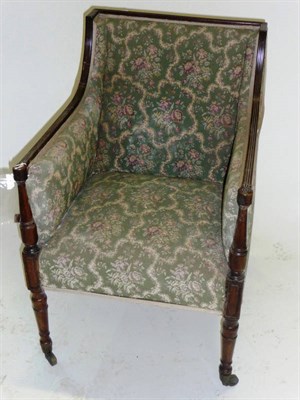 Lot 1441 - A Regency Mahogany Bergère, early 19th century, upholstered in green floral damask, the fluted...