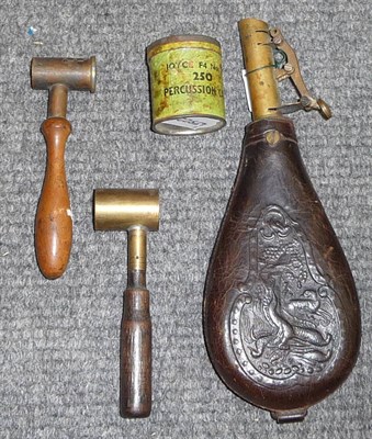 Lot 378 - Accessories:- a leather shot flask, embossed with hanging game, with brass nozzle; two powder...