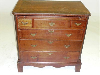 Lot 1444 - A George II Mahogany Chest of Drawers, mid 18th century, the crossbanded top above a pull-out...