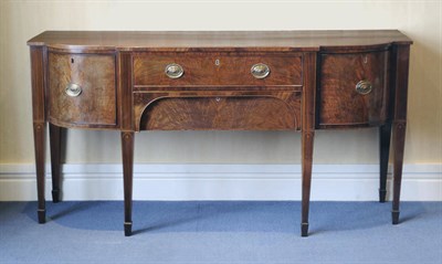 Lot 1450 - A George III Mahogany Breakfront Sideboard, circa 1800, the frieze drawer above a recessed...