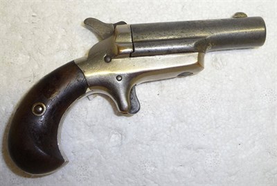 Lot 482 - A Colt Third Model Deringer, .41 calibre, rim fire, the barrel bearing traces of blueing and...